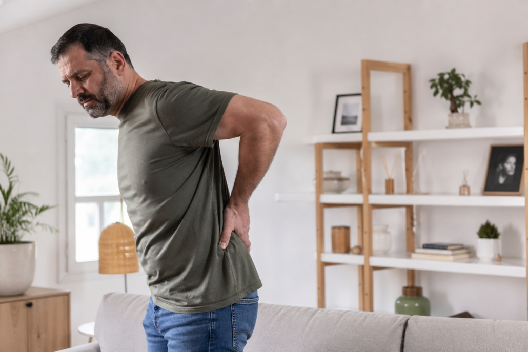 Person experiencing lower back pain in Virginia Beach